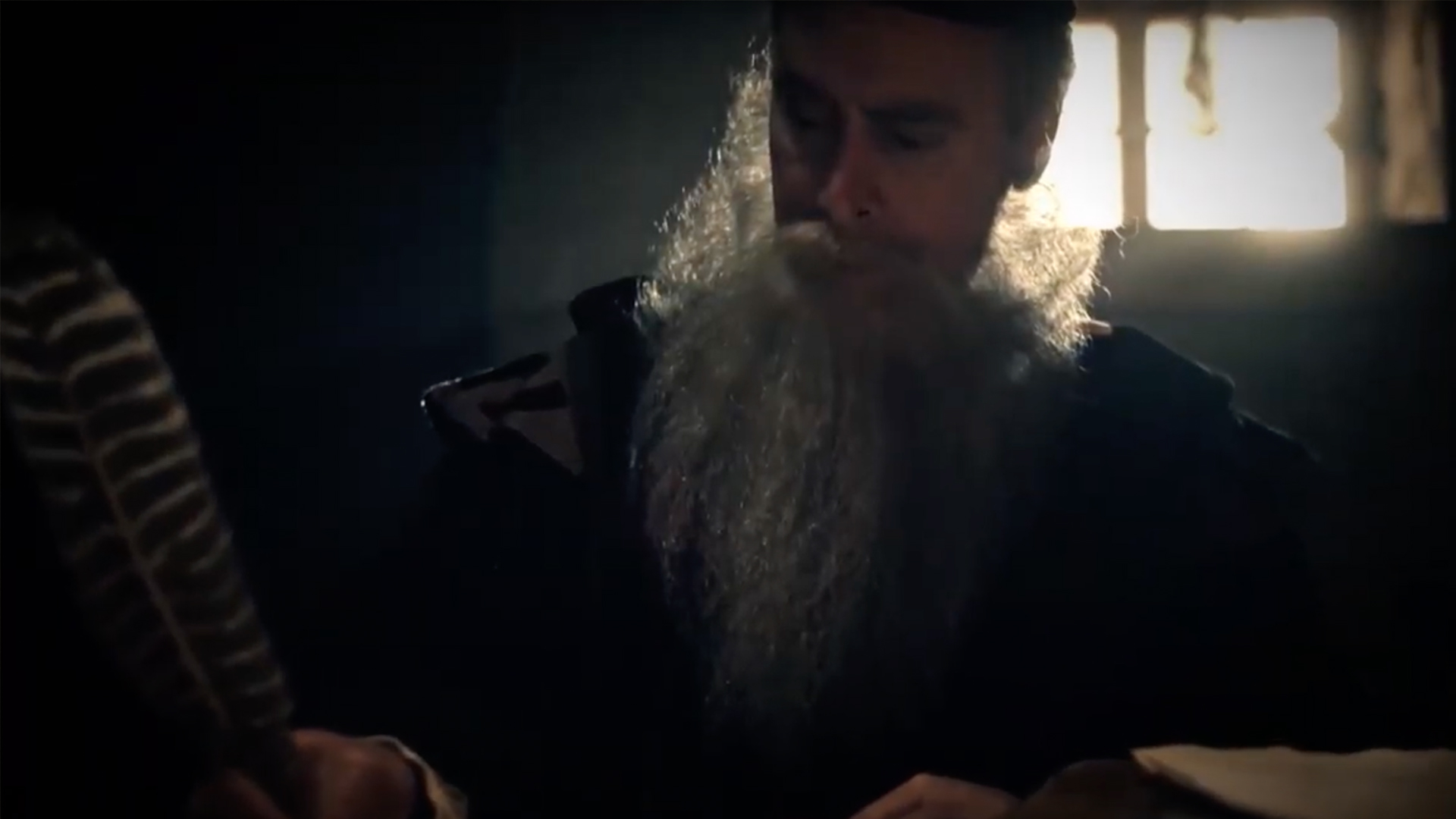 Nostradamus writing with a quill