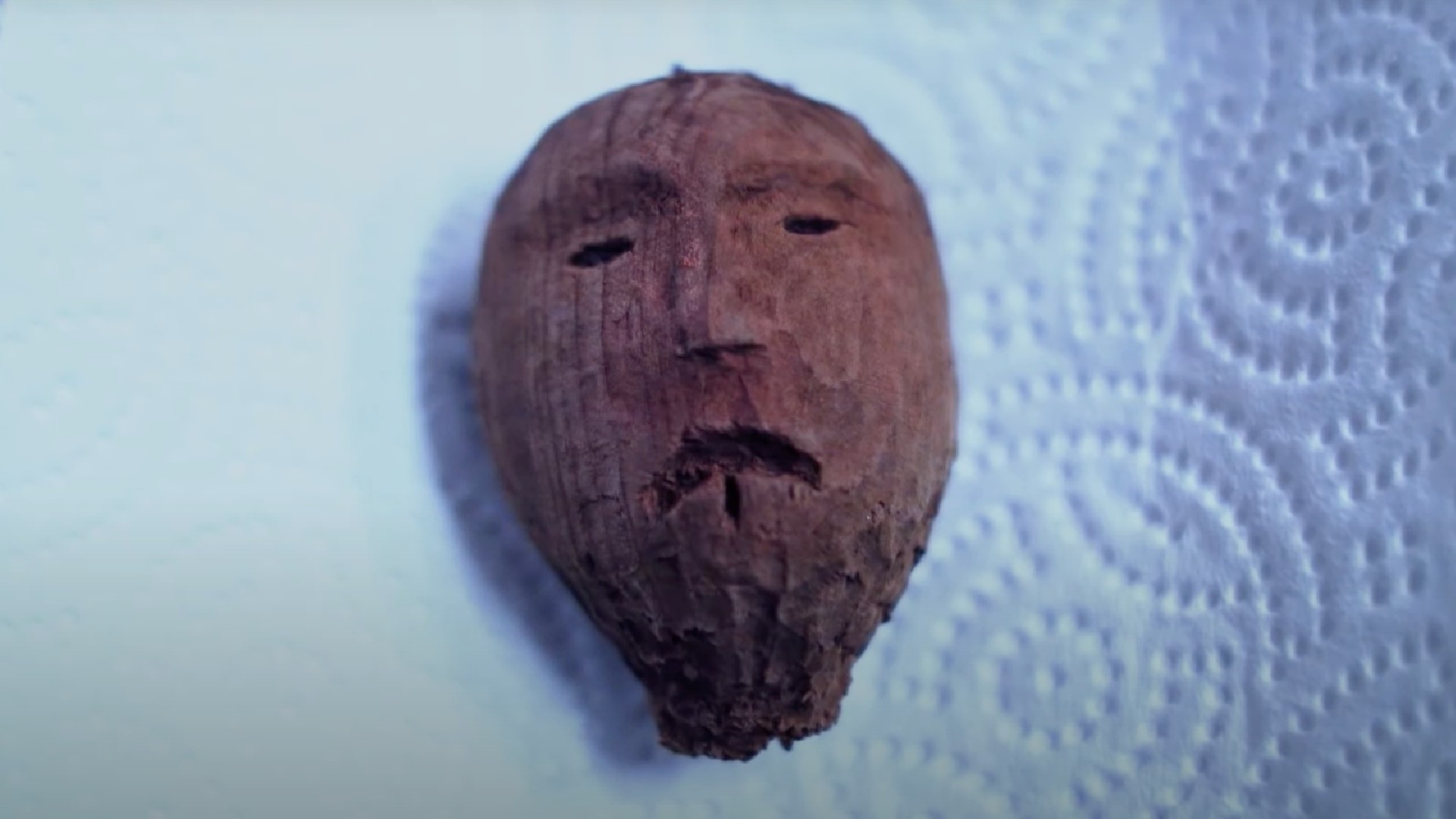 A carved wooden head
