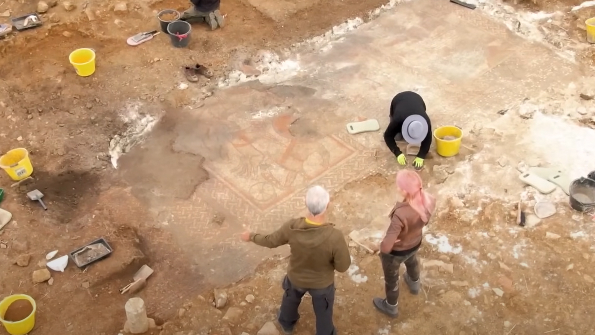Alice Roberts watches as archaeologists uncover a Roman mosaic