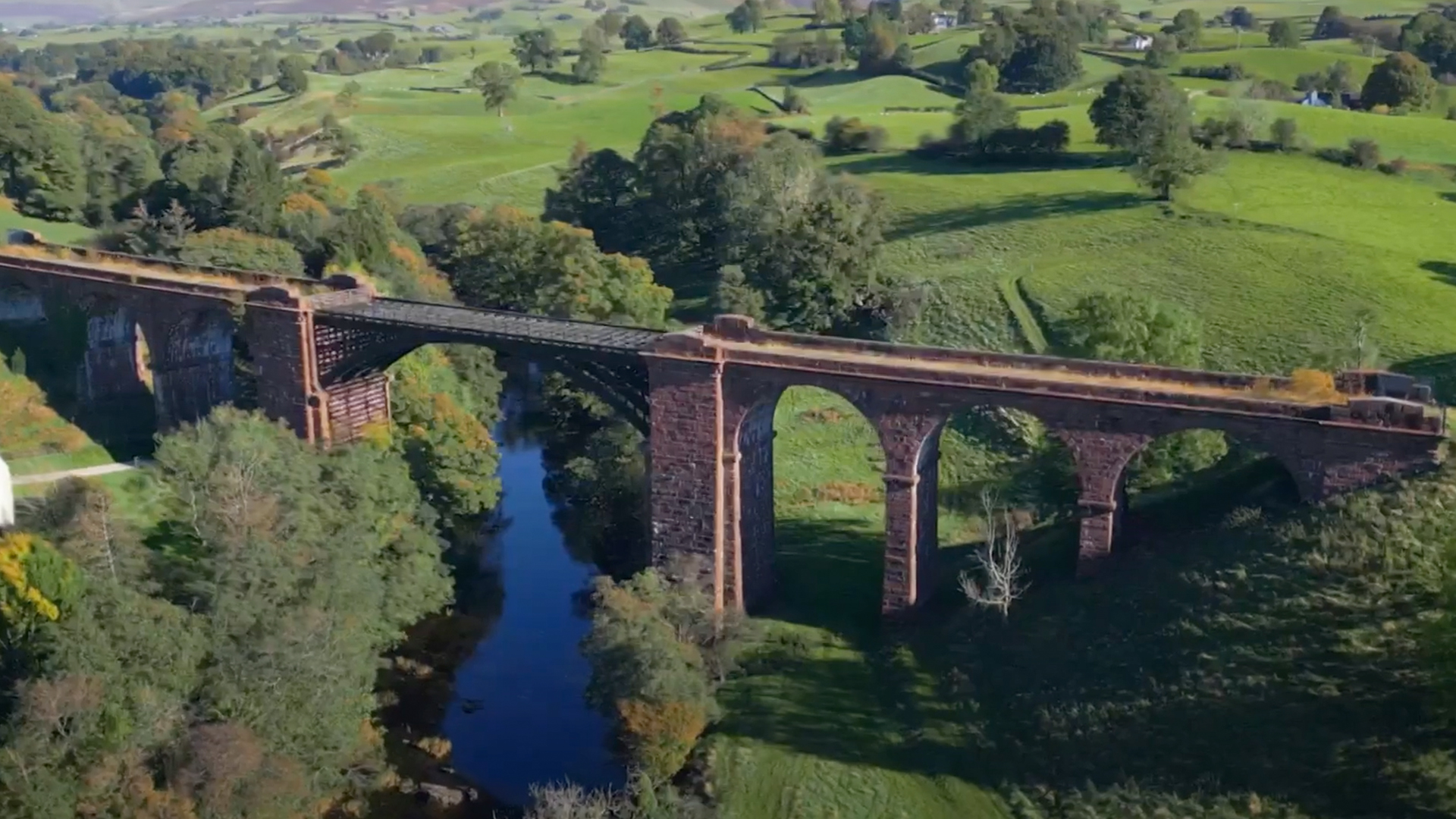 Drone shot of a viaduct in the British countryside