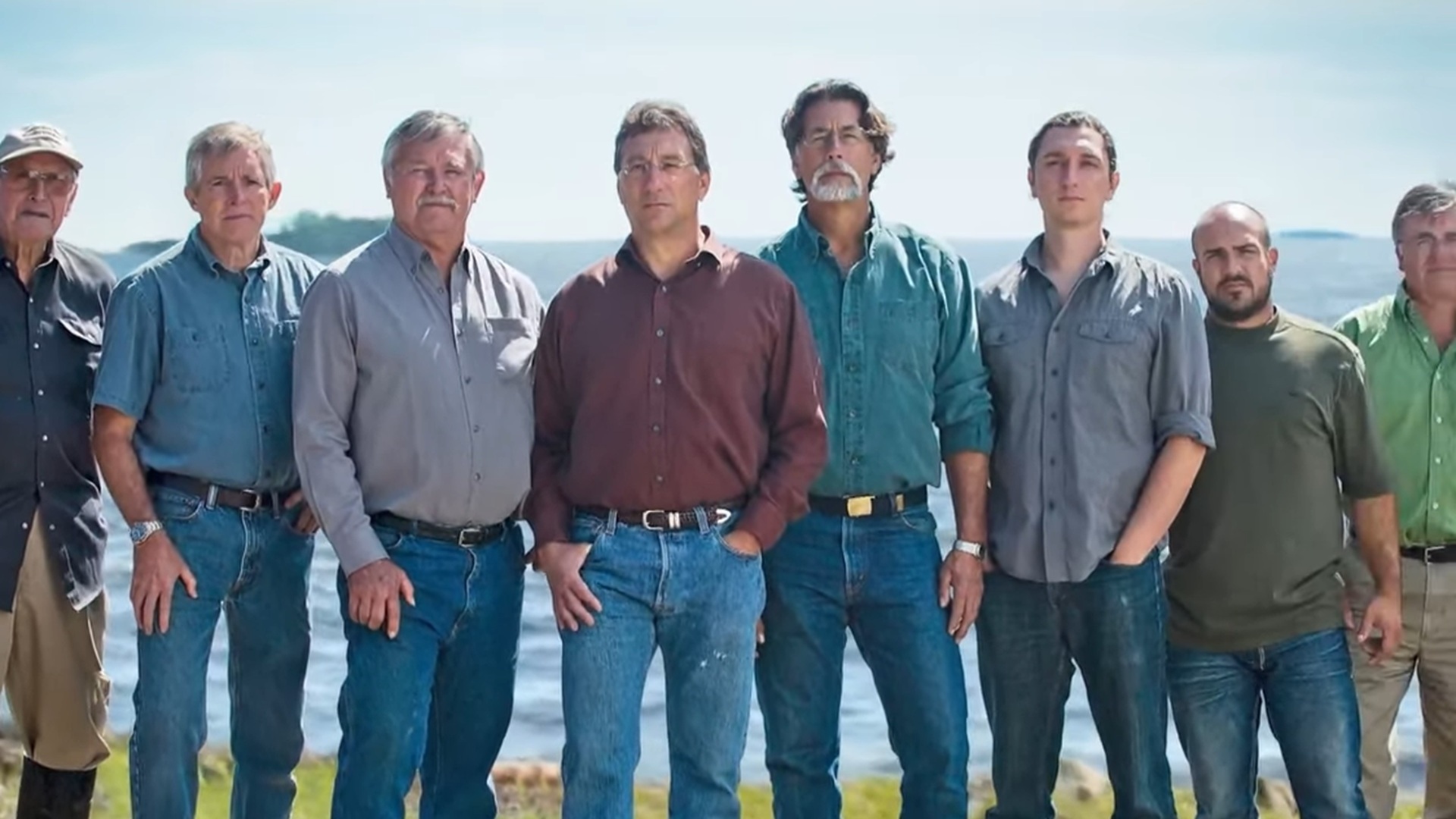 Eight cast members of The Curse of Oak Island, including Rick and Marty Lagina, stood shoulder-to-shoulder while looking at the camera