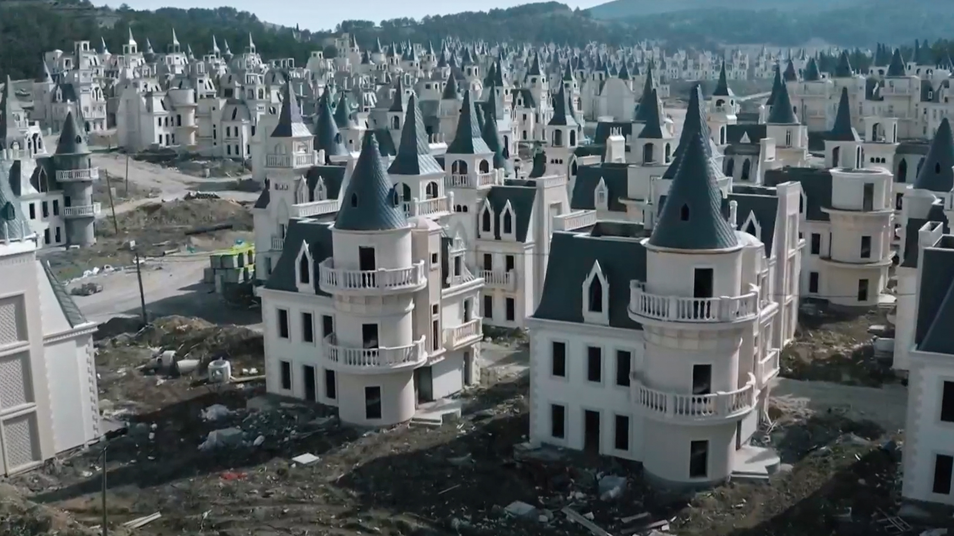 Drone footage of rows of white fairytale castles