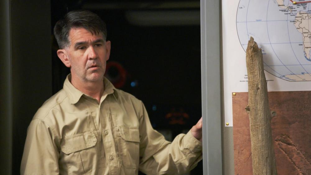 Erik Bard looks into a room while standing in the doorway