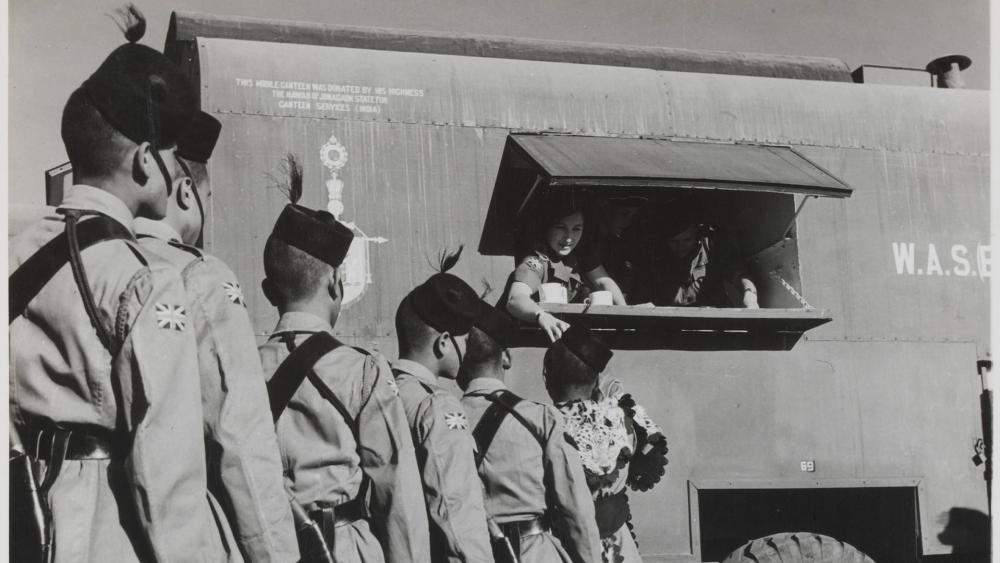 Members of the British-Indian Japan Force queue up for refreshments