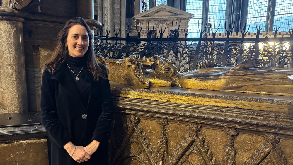 Alice Loxton with Eleanor's tomb in Westminster Abbey