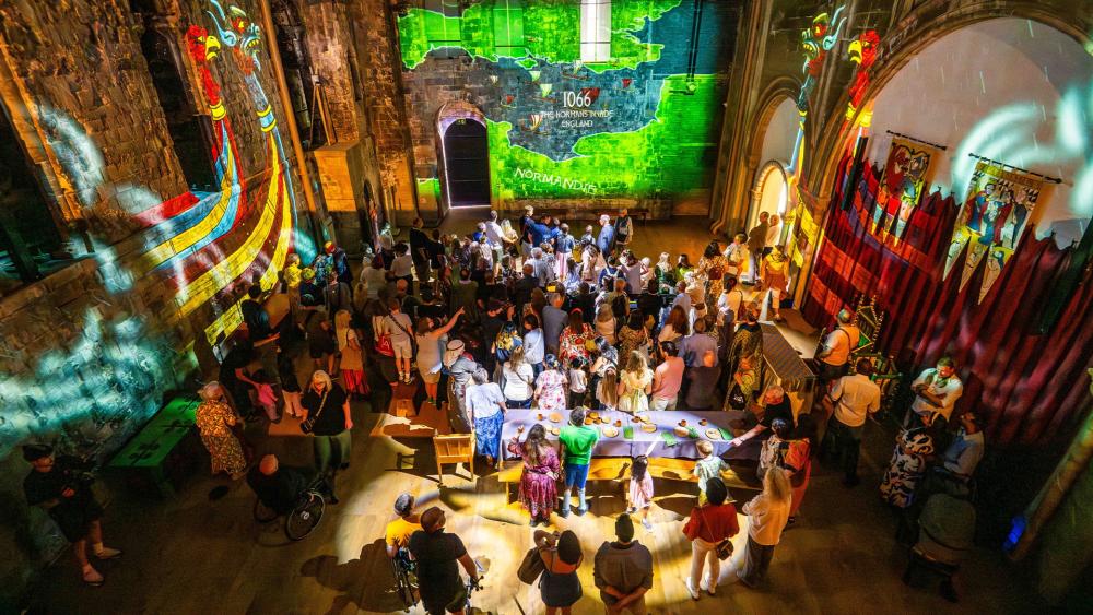 Visitors experience the immersive projections which tell the story of the medieval building in the Great Hall of Norwich Castle Keep