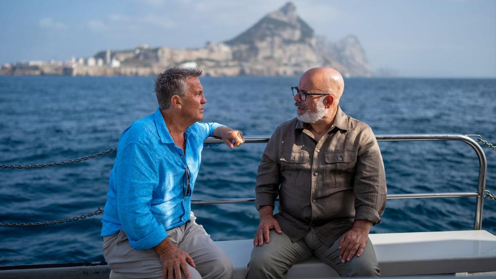 Bradley Walsh and Tony McMahon talk on a boat