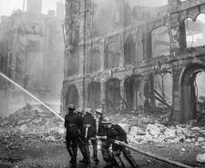 Firefighters tackle a blaze in London after a bombing raid