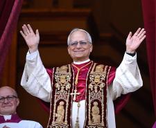 Pope Leo XIV waves to the crowd from the balcony of St Peter's Basilica