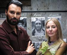 Rylan Clark and Alice Roberts standing with their arms crossed in front of an evidence board