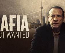MAFIA MOST WANTED - A member of the Mafia sitting in front of the Toronto skyline