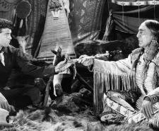 Still from the 1954 film 'Sitting Bull' showing Sitting Bull sitting with Robert Parrish