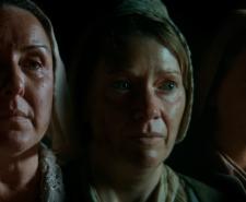 Three female actors portraying 16th and 17th century witches