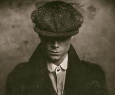 Antique wet plate photo of mysterious 1920s english gangster with flat cap