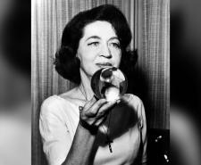 Jeane Dixon holding a crystal ball