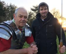 Rob Bell stood with a re-enactor and holding a large spear