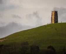 Hikers at Glastonbury Tor on top of the hill