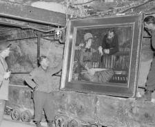 American soldiers looking at Manet's 'Wintergarden' recovered from Merkers Mine
