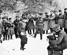 Soviet soldiers dance in the snow to celebrate a successful counteroffensive
