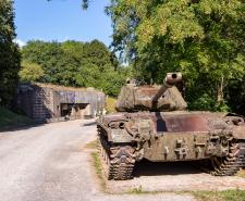 An old tank in front of a military fortification on the Maginot Line