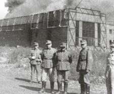 German soldiers standing in front of the Ursus factory, where almost 6,000 residents were executed
