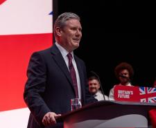 Sir Keir Starmer speaks at the Labour Party Conference in October 2023 while standing at a podium that says, 'Britain's Future'