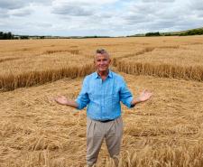 Bradley Walsh standing in a crop circle