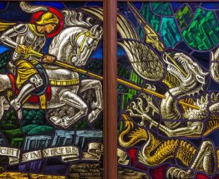 Stained glass window of St George slaying the dragon