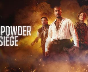 'GUNPOWDER SIEGE' - actors standing in front of an explosion