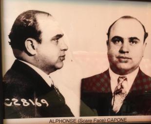 Al Capone's mugshot framed on the wall of a restaurant