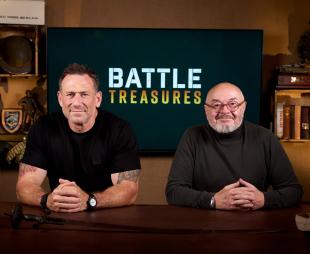 Jason Fox and Bruce Crompton sitting in front of the words 'Battle Treasures' on a television screen