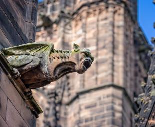 Close up of a gargoyle on the outside of Chester Cathedral