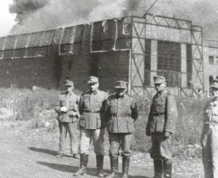 German soldiers standing in front of the Ursus factory, where almost 6,000 residents were executed