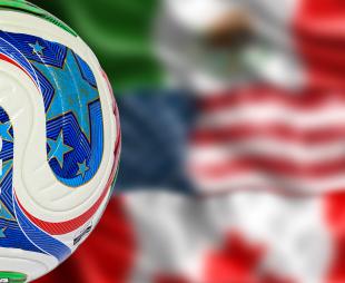 The 2026 World Cup ball in front of the US, Mexico and Canada flags