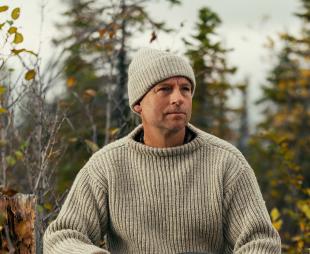 Andrew Price sitting in the forest