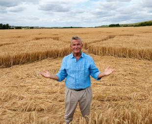 Bradley Walsh standing in a crop circle