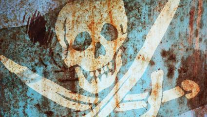 Jolly Roger flag printed on rusty metal