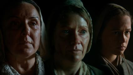 Three female actors portraying 16th and 17th century witches