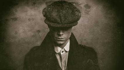 Antique wet plate photo of mysterious 1920s english gangster with flat cap