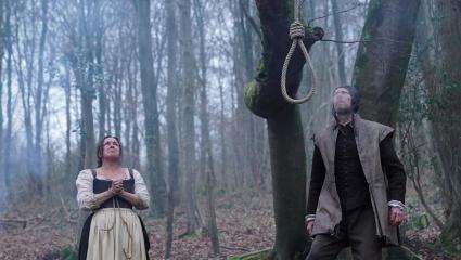 Dramatic reconstruction of Agnes Waterhouse looking up at a noose