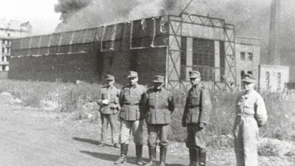 German soldiers standing in front of the Ursus factory, where almost 6,000 residents were executed