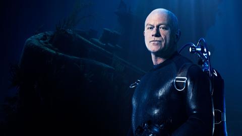 A graphic showing Ross Kemp alongside a shipwreck, for the new Sky HISTORY series 'Ross Kemp: Shipwreck Treasure Hunter'