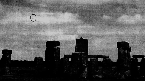 Old photo of a disc-shaped object flying over Stonehenge