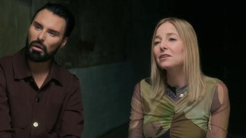 Rylan Clark and Professor Alice Roberts on Witches in Essex. They are seen sitting in a darkened room looking with interest at someone out of sight.