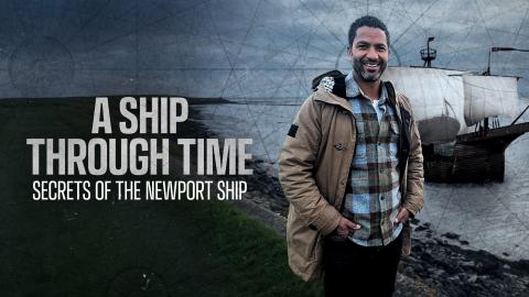 Sean Fletcher stands in front of the River Usk with a rendering of the Newport Ship sailing on it