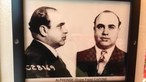Al Capone's mugshot framed on the wall of a restaurant