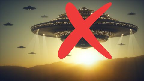 Large UFOs hover above mountains at sunset with a big red X drawn over the scene.