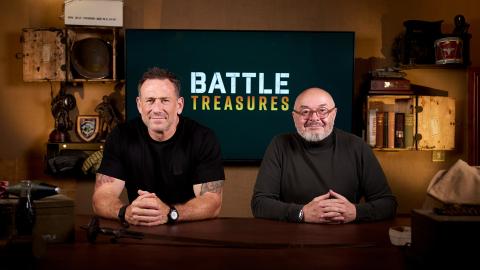 Jason Fox and Bruce Crompton sitting in front of the words 'Battle Treasures' on a television screen