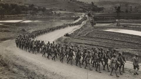 Black and white photograph of Chinese soldiers marching during WWII