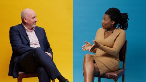 A man and a woman sitting either side of a divided background which is yellow on the left and blue on the right
